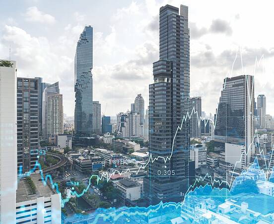 Forex and stock market chart hologram over panorama city view of Bangkok, the financial center in Southeast Asia. The concept of international trading. Double exposure.