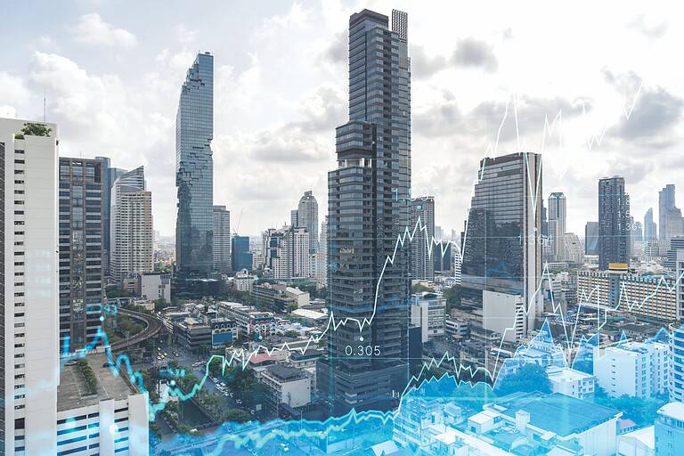 Forex and stock market chart hologram over panorama city view of Bangkok, the financial center in Southeast Asia. The concept of international trading. Double exposure.