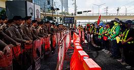 Police lines and protesters outside the IMF and World Bank annual meetings in Bangkok, Thailand.